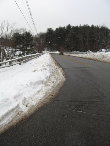 The sidewalk on the bridge near the Riverhill Market remains unplowed.