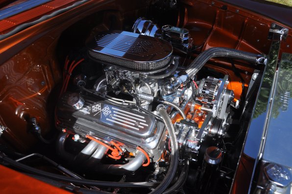 The engine of a 1955 Chevy Bel-Air looks showroom sharp.