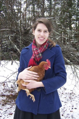 Elizabeth Broussard holding “Eggatha Christie,” a Golden Comet hen. Broussard keeps chickens at her Concord home.