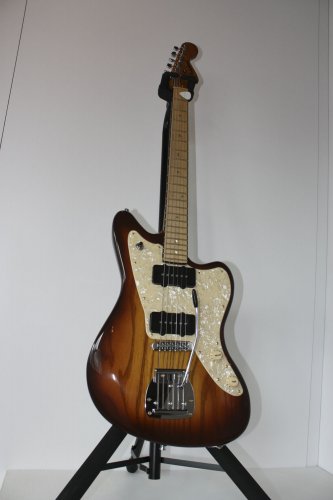 This electric jazz guitar was created by Richard Robichaud. Sweet sunburst!