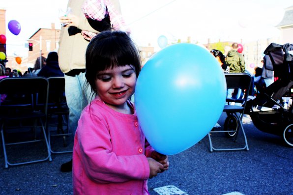 Two (and a half, we’re told!)-year-old Sophia Waters loves her new balloon.