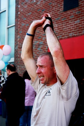 Rob Rojek leads a boot camp-style exercise class, right out there on the street.