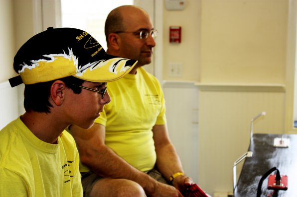 Jonathan Bianchi, 14, focuses intently on the track as he races against his dad, Bob Bianchi.