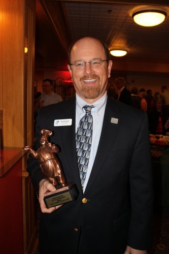 Concord YMCA Director Jim Doremus with the Top Chef cookoff trophy.