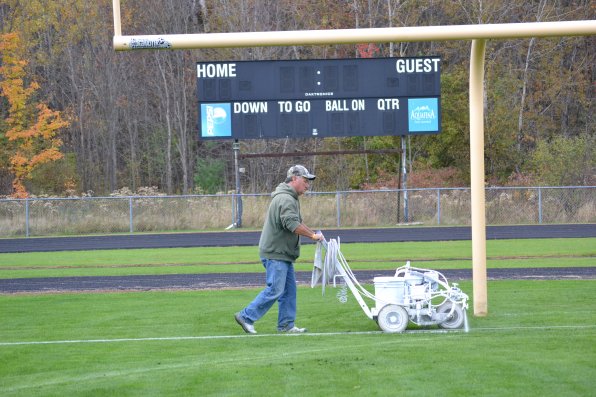 Tom “Kite” Wright scores countless points when he paints Memorial Field each week, even if the scoreboard doesn’t officially light up until gametime on Friday nights.