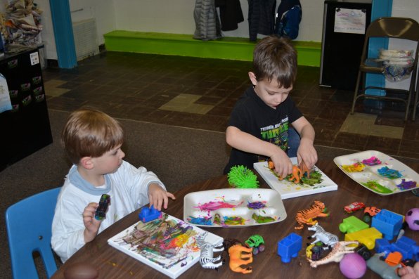 Eli Novotny and Jacob Plodzik, both 4, used plastic animals, forks, foam balls and a potato masher to create some pretty colorful pieces of art at No Brushes Allowed on Sunday. The artistic hot spot for children is one of the newest tenants at the Concord Community Arts Center.