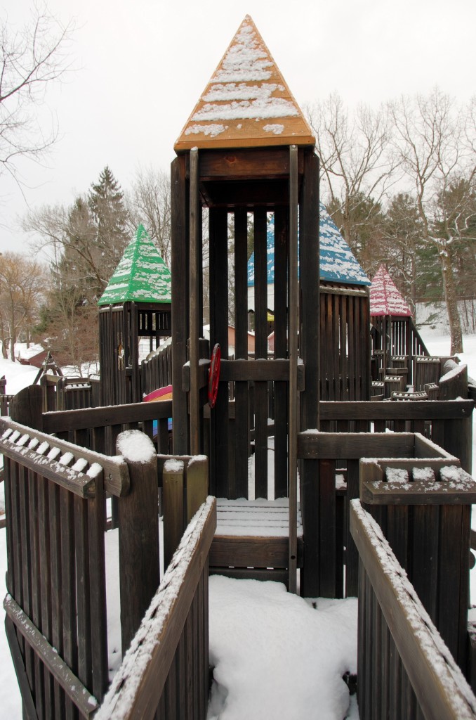 With a dusting of powder, the playground at the park waits quietly for the return of joyful sounds.  Photo courtesy of Larry Levinson.