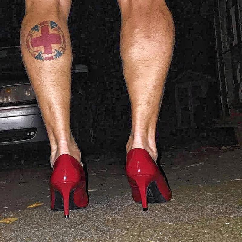 man in red heels