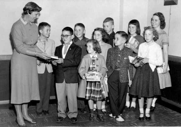 Bertha Rosen, president of the Woman's Club of Concord, gives out the summer reading awards at the City Auditorium in 1955.