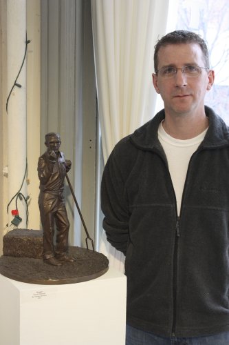 Artist Tom Devaney with one of his sculptures. Devaney is donating a commissioned figurative sculpture to the Friends Auction that can be made in the winning bidder’s likeness.