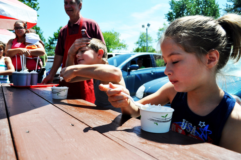Logan Drew, 9, powers through what appears to be a grade 3 (grading system made up by us) ice cream headache while Jaden Drew, 7, digs in during the ice cream eating contest at Arnie’s on Saturday afternoon.