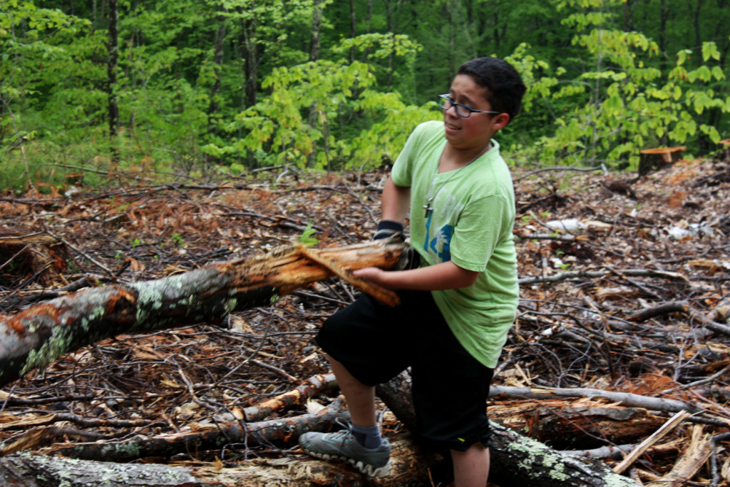 Parker Academy student Jonathan Parada, 11, hoists a log while clearing timber at a new trail vista on the Marjory Swope Trail. Read on for tons more trail stories and photos in this week’s trails issue!