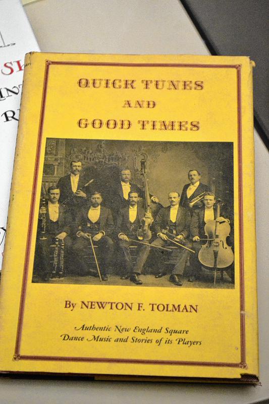 An old book with lots of dancing and music stuff. (TIM GOODWIN / Insider staff) - 
