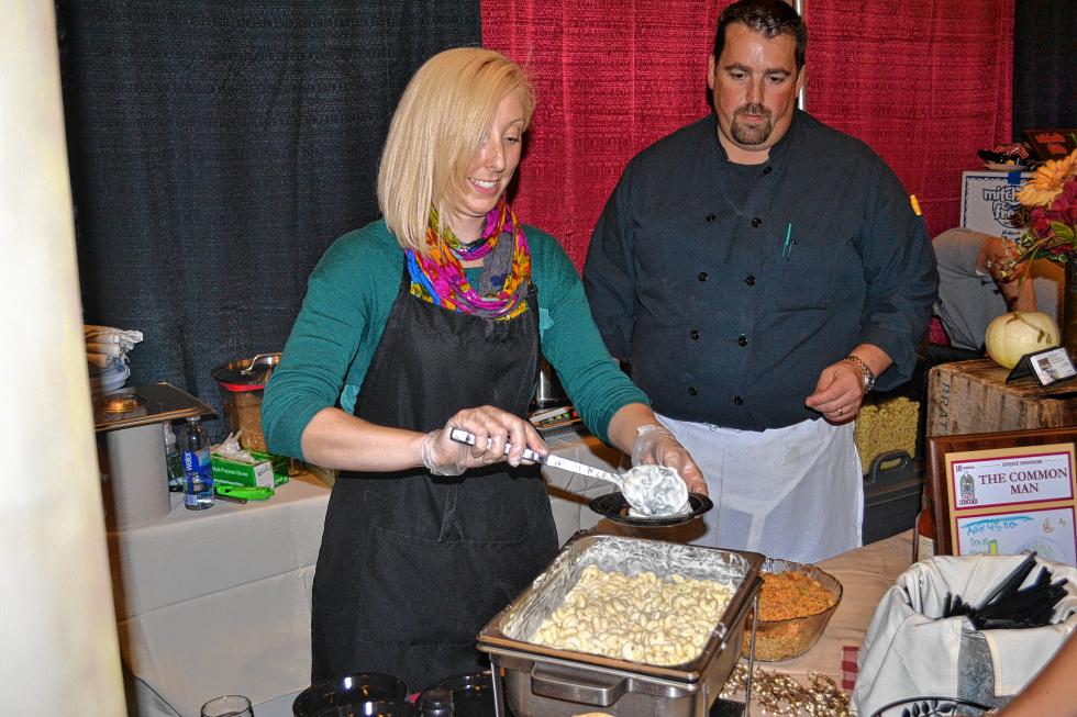Tricia Beauchemin serves up some tasty looking mac and cheese from the Common Man booth. (TIM GOODWIN / Insider staff) - 
