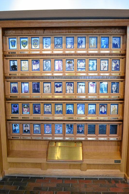 Right when you walk into the academy, you see this wall of photos honoring every police officer who has ever died in the line of duty in New Hampshire. (TIM GOODWIN / Insider staff) -