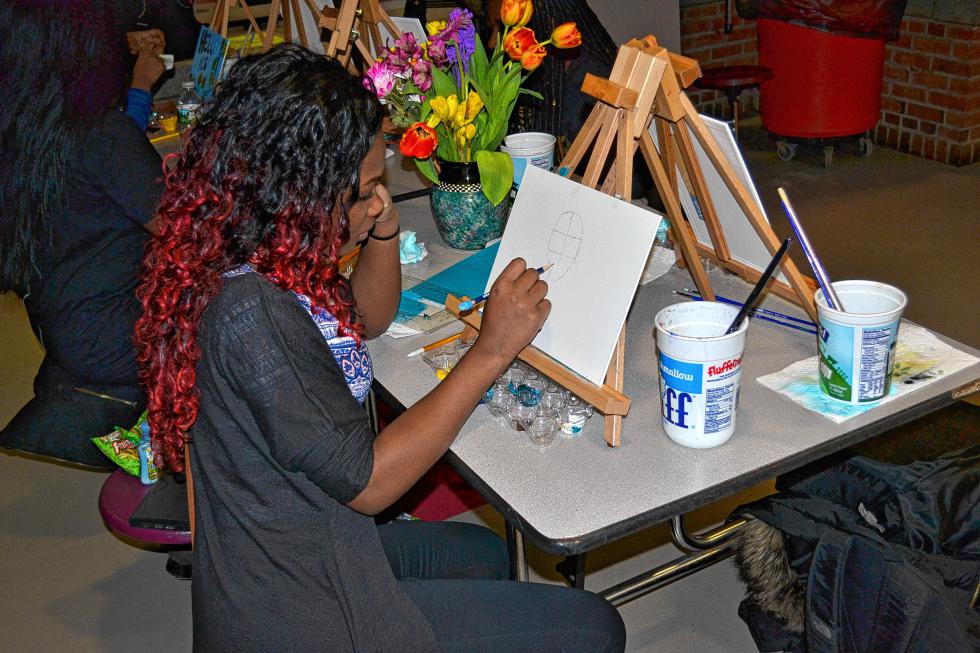 Freshman Rebecca Bosa sketches out her painting project before even touching a brush. (TIM GOODWIN / Insider staff) -