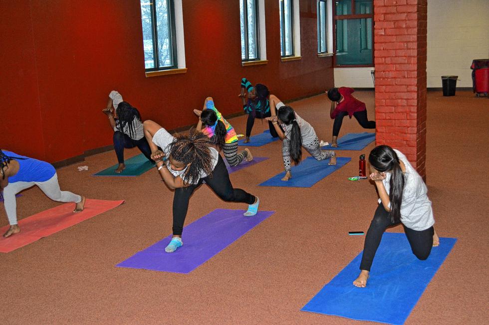 The high school yoga program at 21C is quite popular. And as you can see, they do all kinds of poses and movements – stuff we likely wouldn’t be able to do. It’s pretty technical stuff. (TIM GOODWIN/ Insider staff) -
