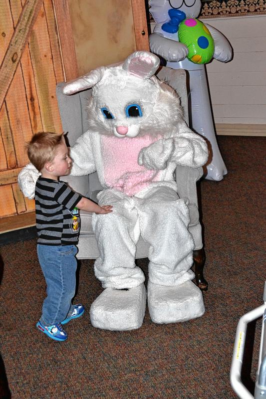 Aedan Lemay, 2, puts a good word in with the Easter Bunny. (TIM GOODWIN / Insider staff) -