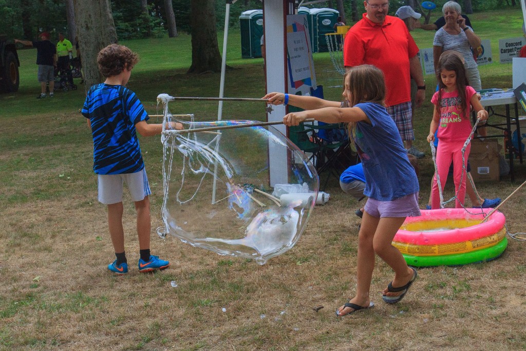One booth allowed children to create large bubbles at National Night Out at Rollins Park in Concord, NH. August 2, 2016. (JENNIFER MELI / Monitor Staff)