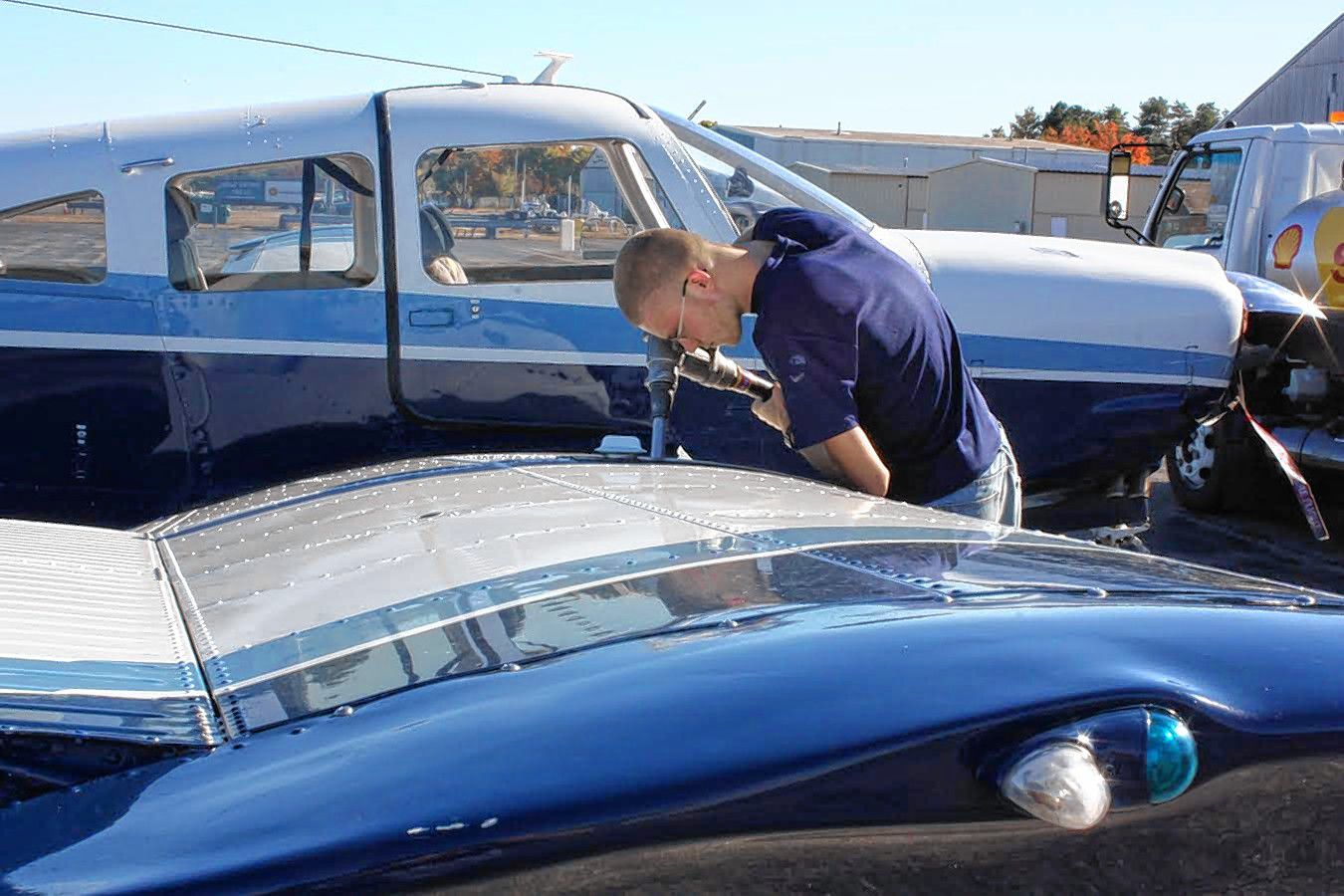 Jon Bodell / Insider staffTop: Grant Richardson adds a little fuel to a plane at the Concord Municipal Airport. You don’t want to run out of fuel way up in the sky. Bottom: Planes waiting to be flown.