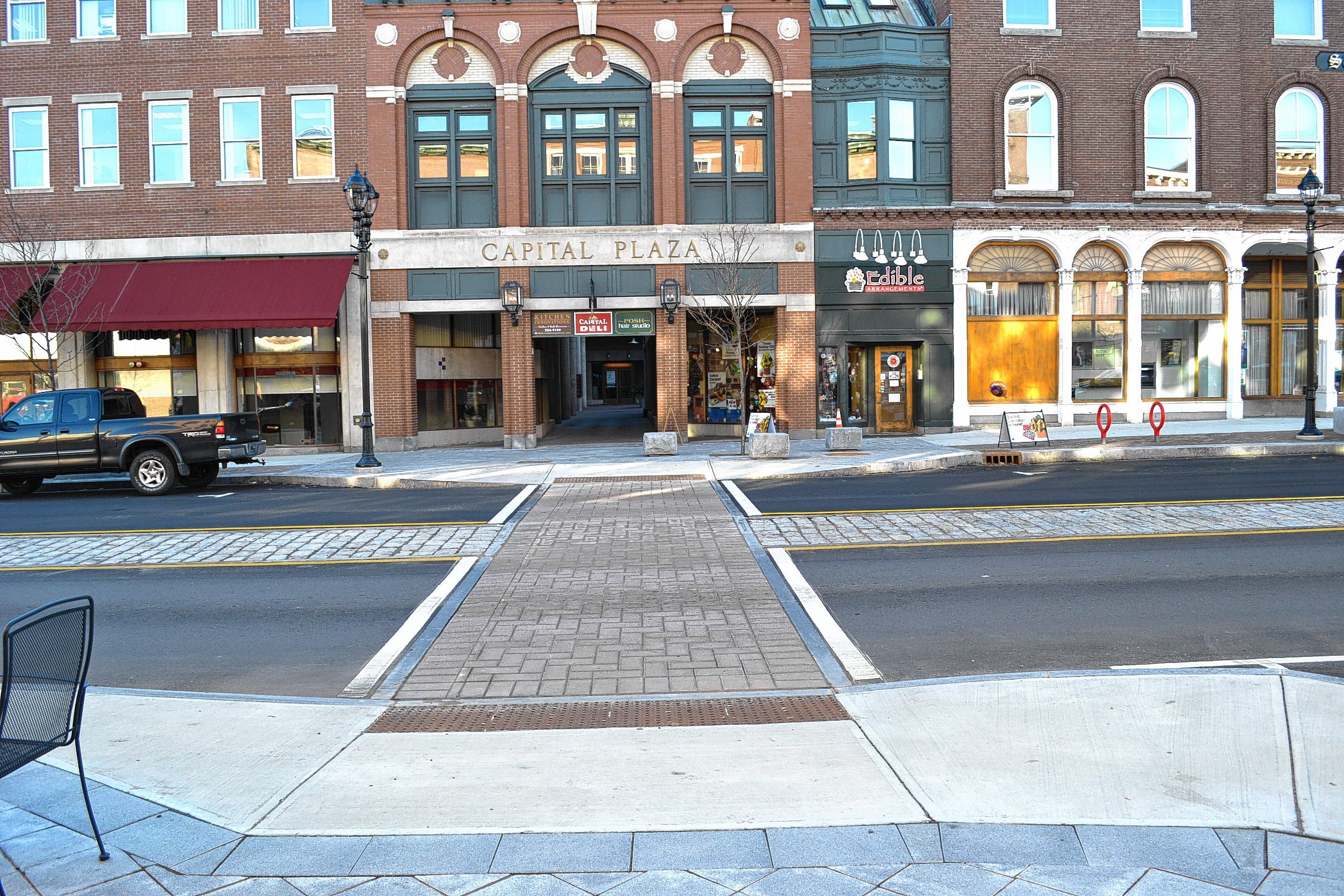 After a long construction process, work has finally wrapped up on North Main Street. No more trucks, slabs of bricks and pavers, crews of (friendly) construction workers or open ditches. No more one-way traffic on the main road, either, which is nice. But really it was worth it cause the whole thing looks nice, so kudos to the city and Severino Trucking for doing such a fine job. Also, kudos to everyone else who showed patience during the whole project. Top left: Look at that nice new crosswalk made of pavers. Top right: That’s a new light post, with a new tree behind it, sitting in a new planting bed, and there are new benches behind that. Impressive! Bottom right: Okay, so maybe the construction crews didn’t put up this awesome sign, but it is totally worth showing you anyway. Nice watch, Eli! Maybe it will help you with clock management? Bottom left: One of the bumpouts on the sidewalk provides some granite blocks to sit on, a now-leafless tree to gaze at and some receptacles to throw your trash or recyclables in. Not bad.TIM GOODWIN / Insider staff