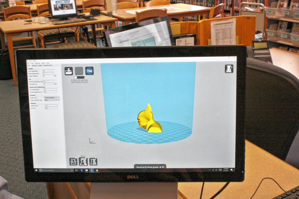Concord Public Library Director Todd Fabian (not pictured) demonstrates the software program Cura, which is used to set the parameters of the 3-D printer. This model is a bust of Wolverine.(JON BODELL / Insider staff)
