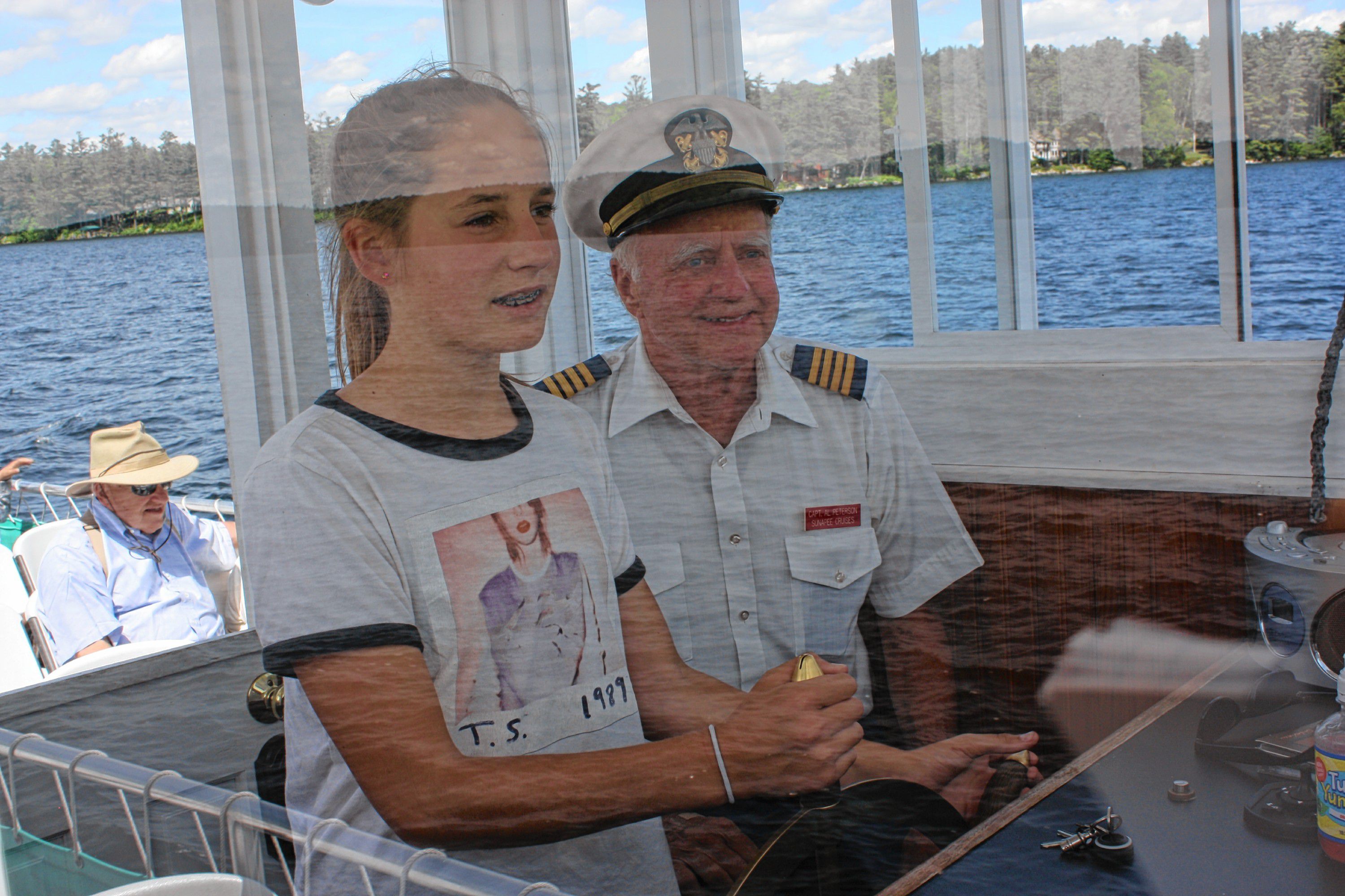 M.V. Mt. Sunapee II Capt. Al Peterson lets Olivia Dorion, 12, of California drive the ship for a little bit. The vessel didn't crash or sink, so we say Olivia did quite a nice job.  JON BODELL / Insider staff