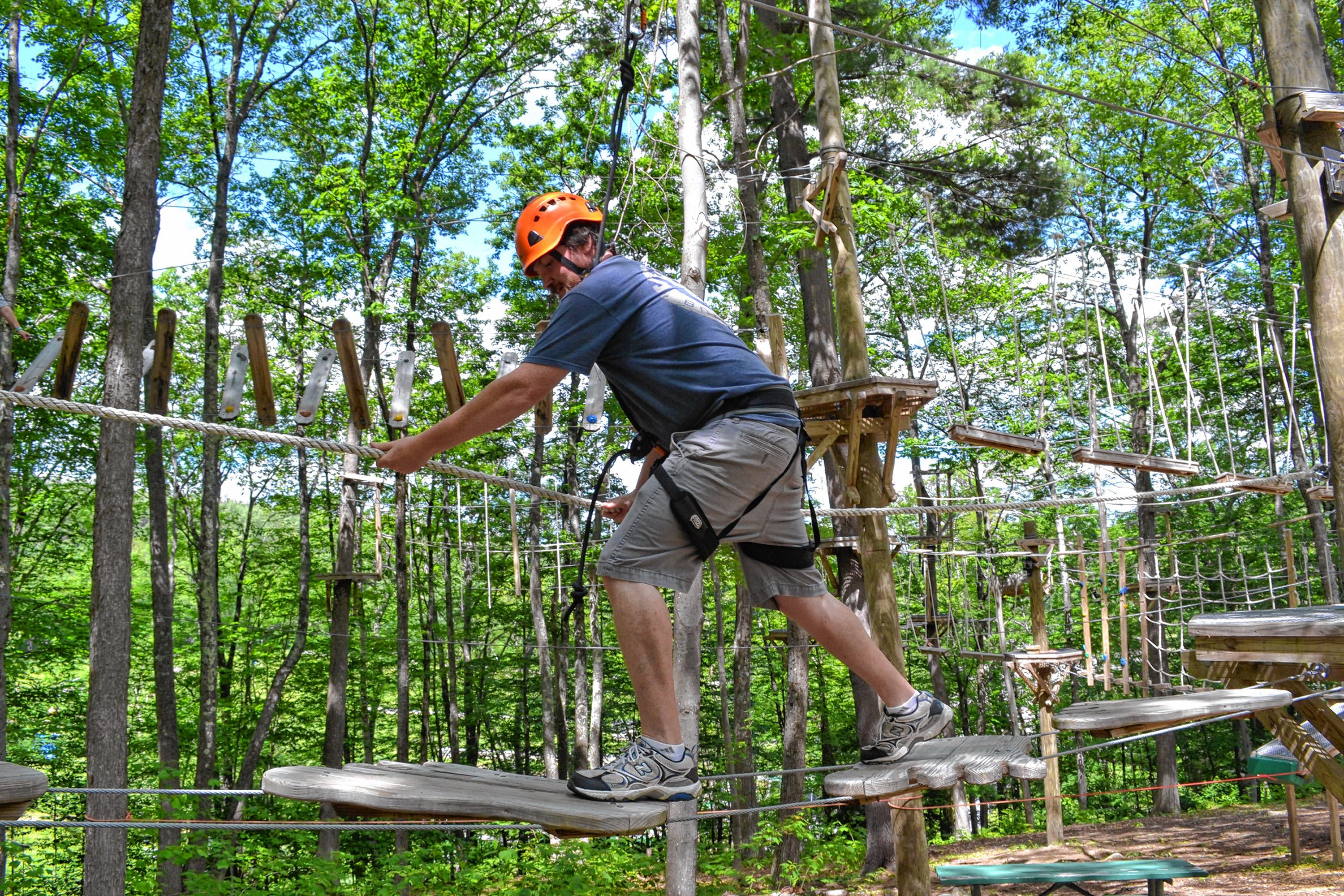 Tim took a spin around the aerial challenge course at Mount Sunapee's adventure park. MEGAN BURCH / For the Insider