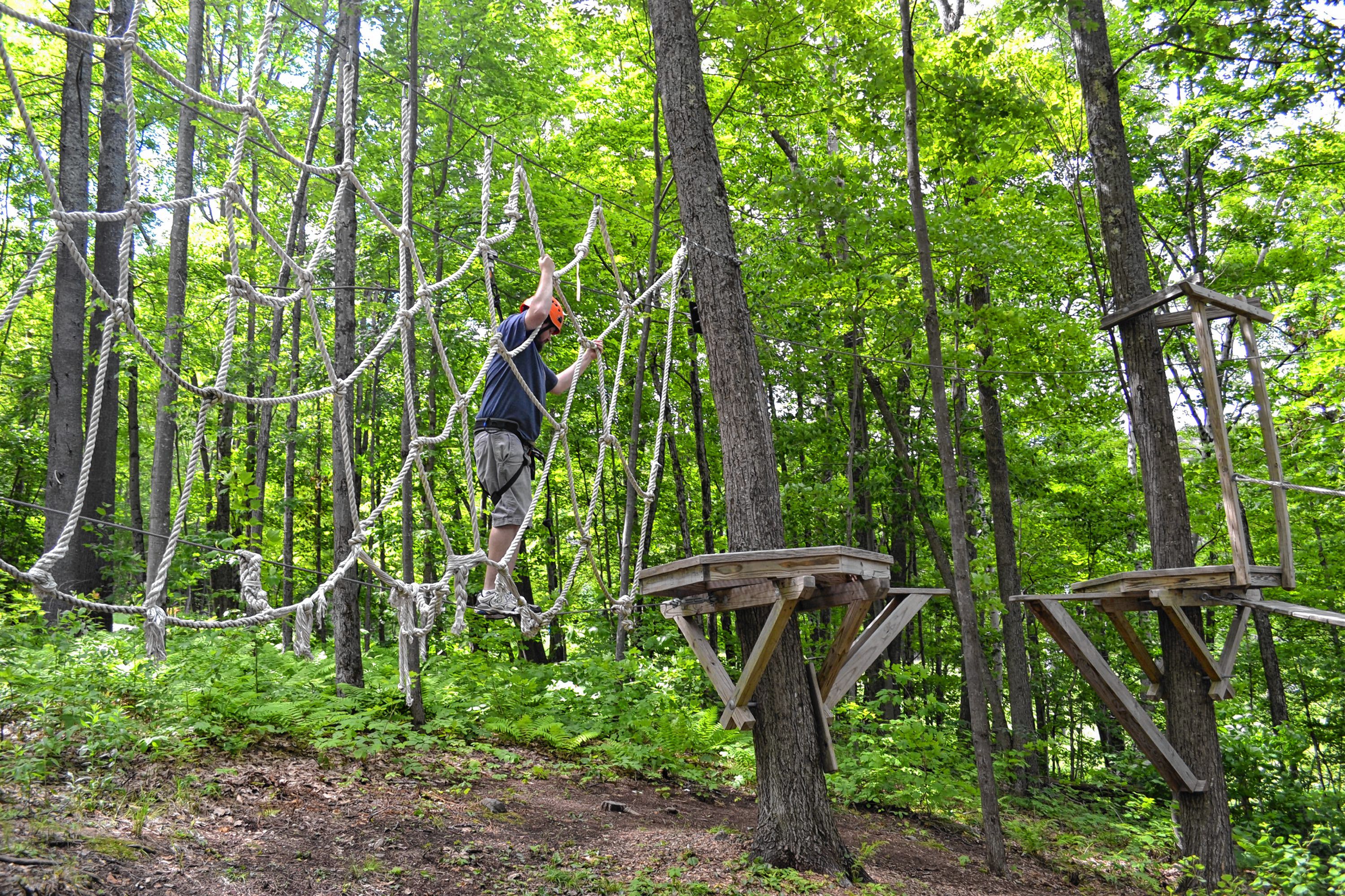 Tim took a spin around the aerial challenge course at Mount Sunapee's adventure park. MEGAN BURCH / For the Insider