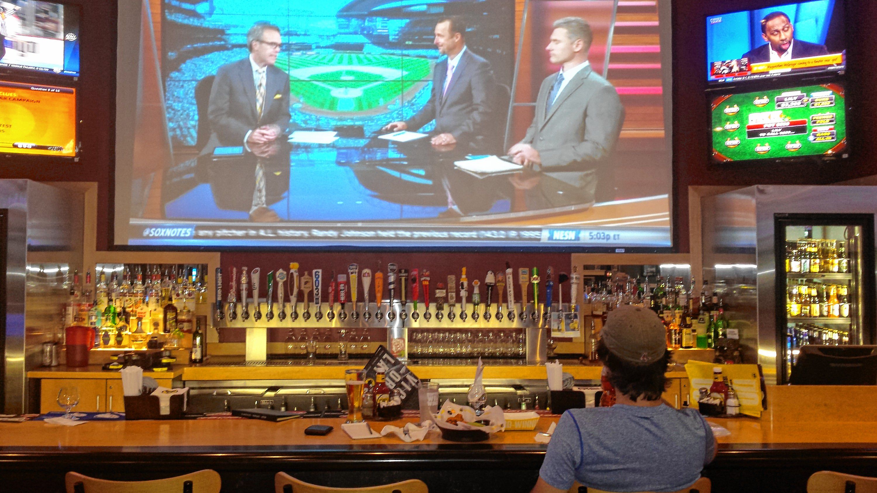 Jon watches Tom Caron, Tim Wakefield and Lenny DiNardo break down the Red Sox game at Buffalo Wild Wings last week. That projection screen is awesome for watching a game. TIM GOODWIN / Insider staff