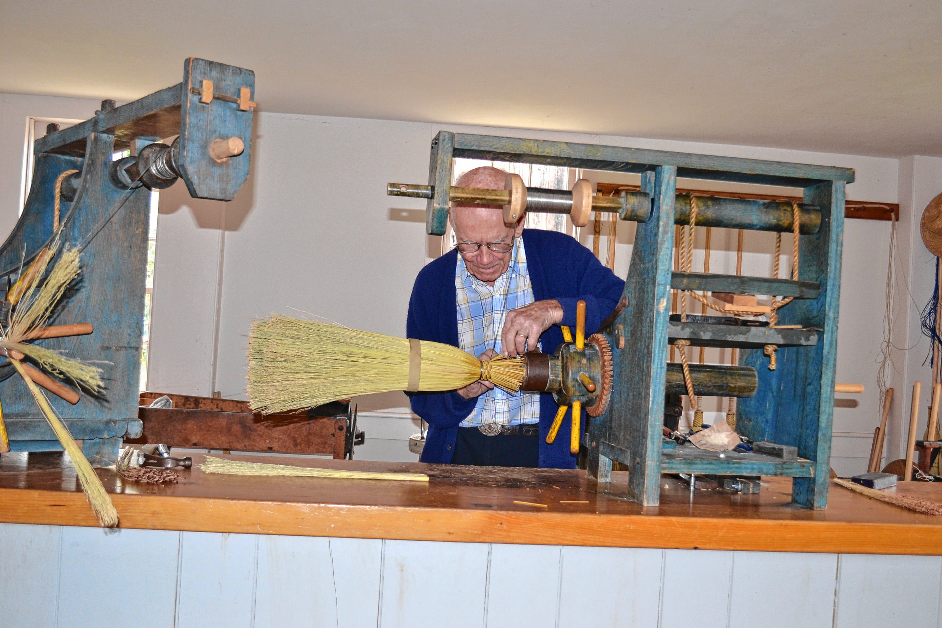 Joe Rogers does his broom making demonstration during a tour of Canterbury Shaker Village. Tim Goodwin / Insider staff