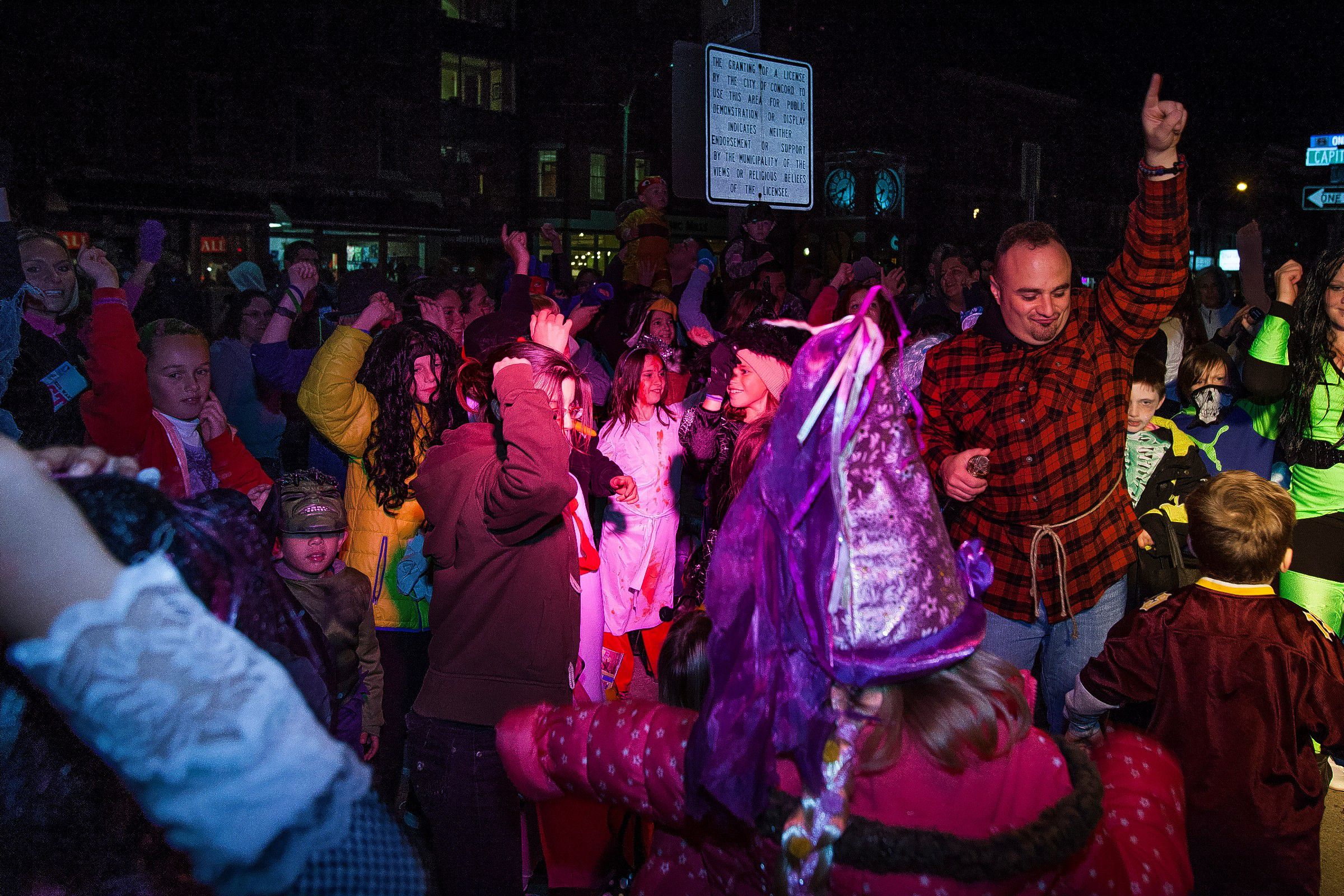 DJ Nazzy (right) leads a dance party during the annual Downtown