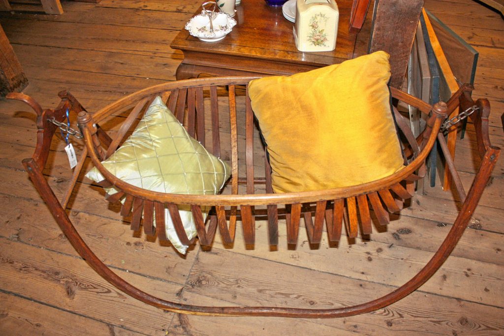 This contraption here is an antique field cradle we found in the basement of Hilltop Consignment Gallery downtown. Apparently these were used back in the day when Mom and Pop were out working the fields and little Suzie or Billy needed to take a nap but couldn't be left alone in the house. JON BODELL / Insider staff