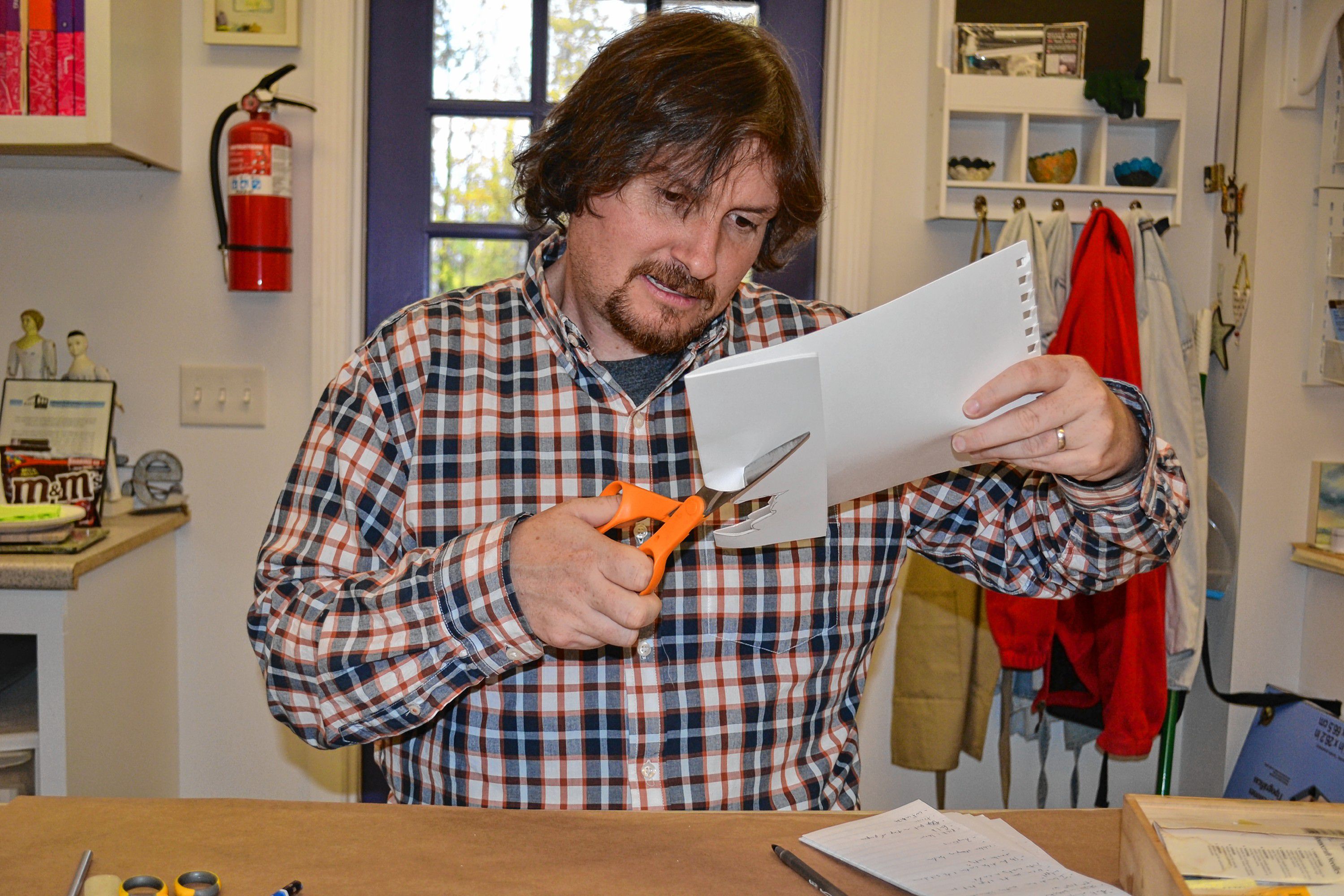 Tim makes a leaf book at Twiggs Gallery, a craft that you can try during a visit to the Boscawen art hotspot. ADELE SANBORN / For the Insider