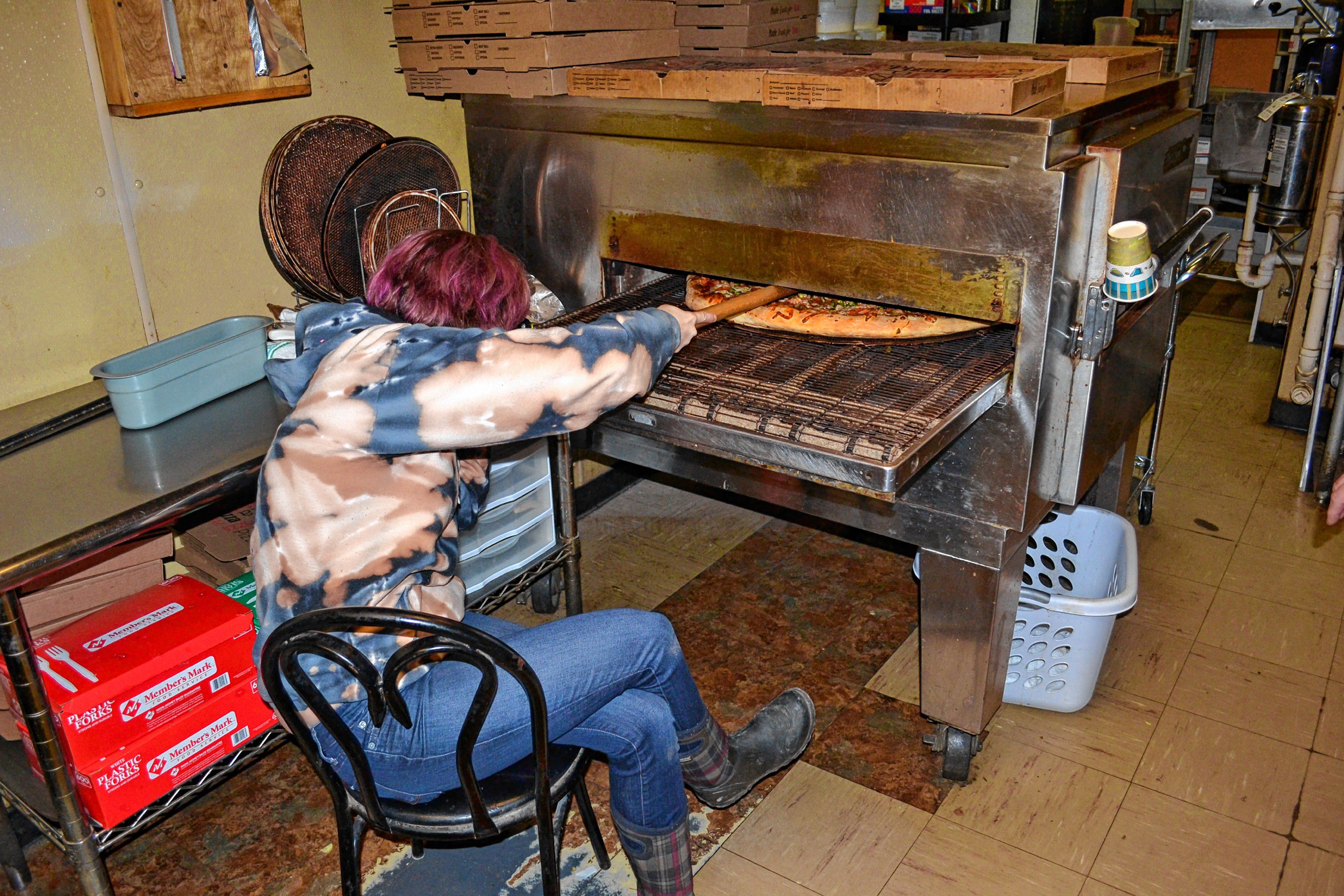 Rylee Orlosk got the envious job of sitting at the end of the oven and popping bubbles in one of Donatello's famous super dominators. TIM GOODWIN / Insider staff