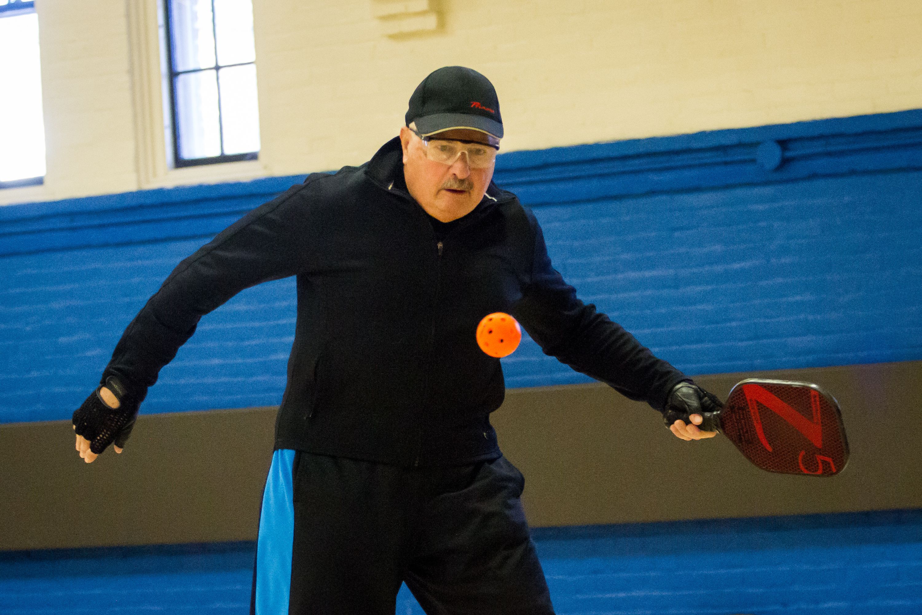 Steve Michlovitz keeps his eyes on the ball during a game of pickleball at the Green Street Community Center in Concord on Friday, Jan. 26, 2018. (ELIZABETH FRANTZ / Monitor staff) Elizabeth Frantz