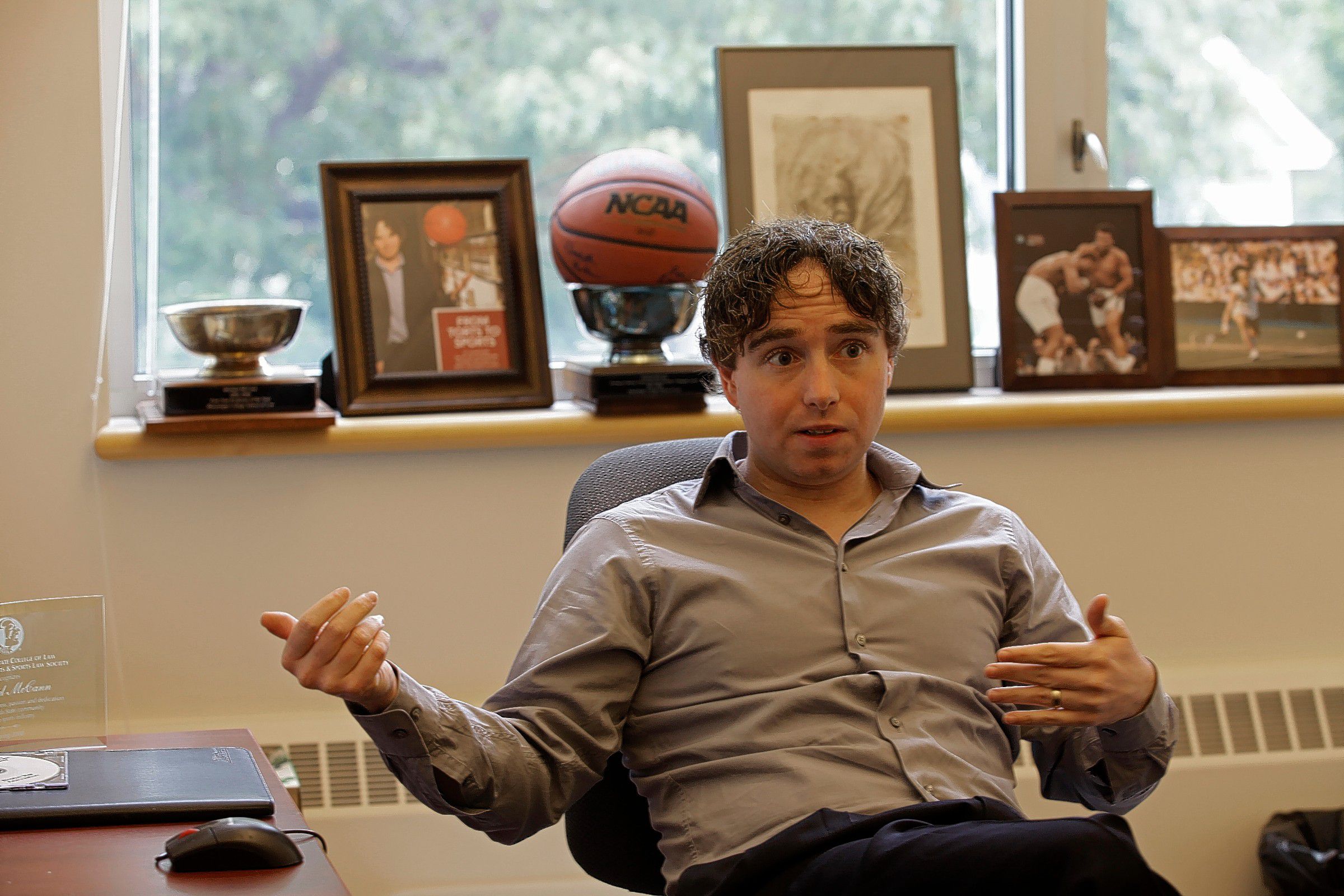 Michael McCann, a professor and writer, sits in his office at UNH School of Law in Concord on Tuesday, Sept. 30, 2014. Michael McCann, a professor and writer, sits in his office at UNH School of Law in Concord last week. Susan Doucet