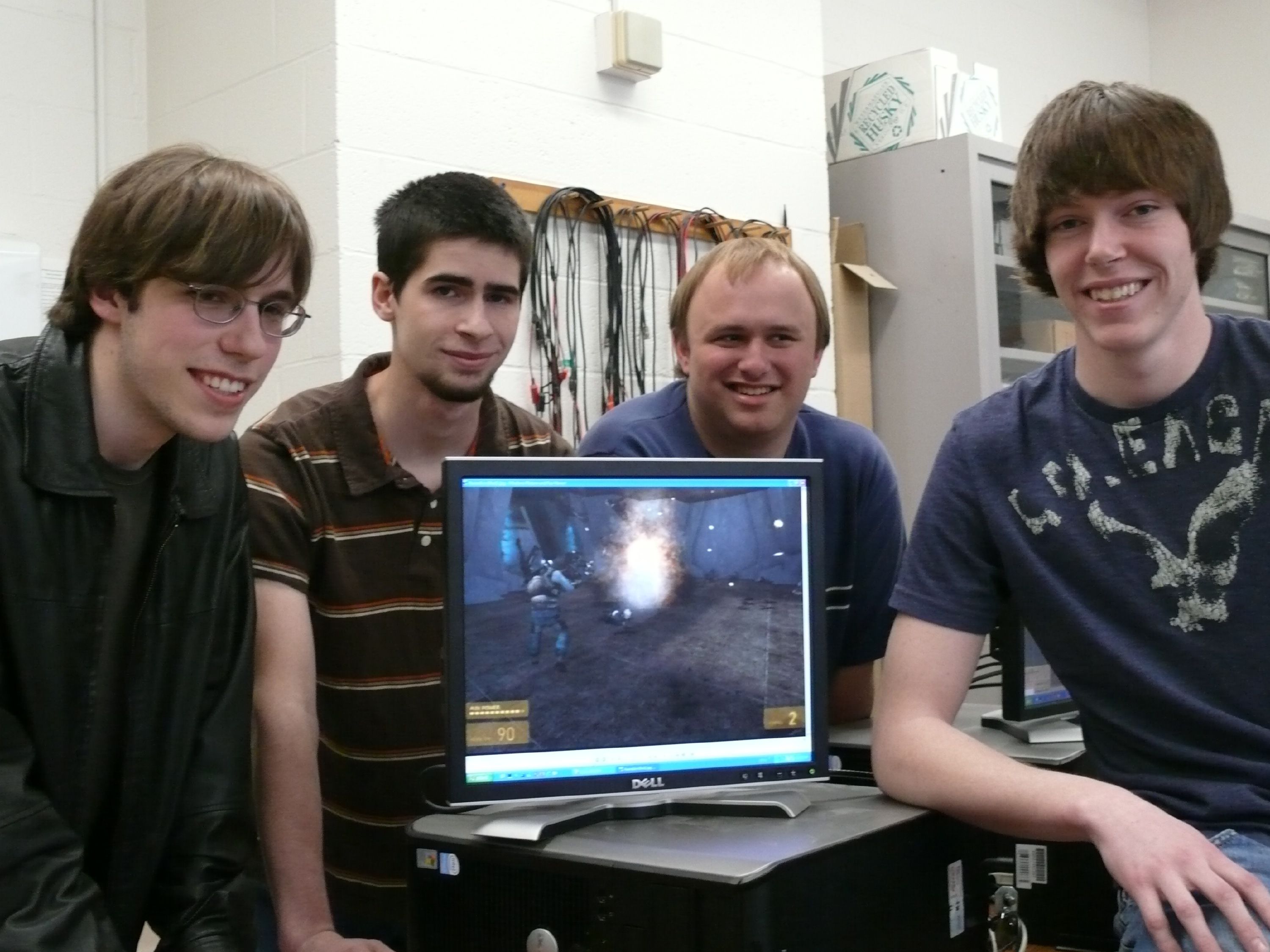 A team of NHTI Animation and Graphic Game Programming students who took second place in an industry-sponsored regional competition in 2008 pose for a photo with their game called "Infectious Munch," originally developed during a Game Jam. Courtesy of NHTI