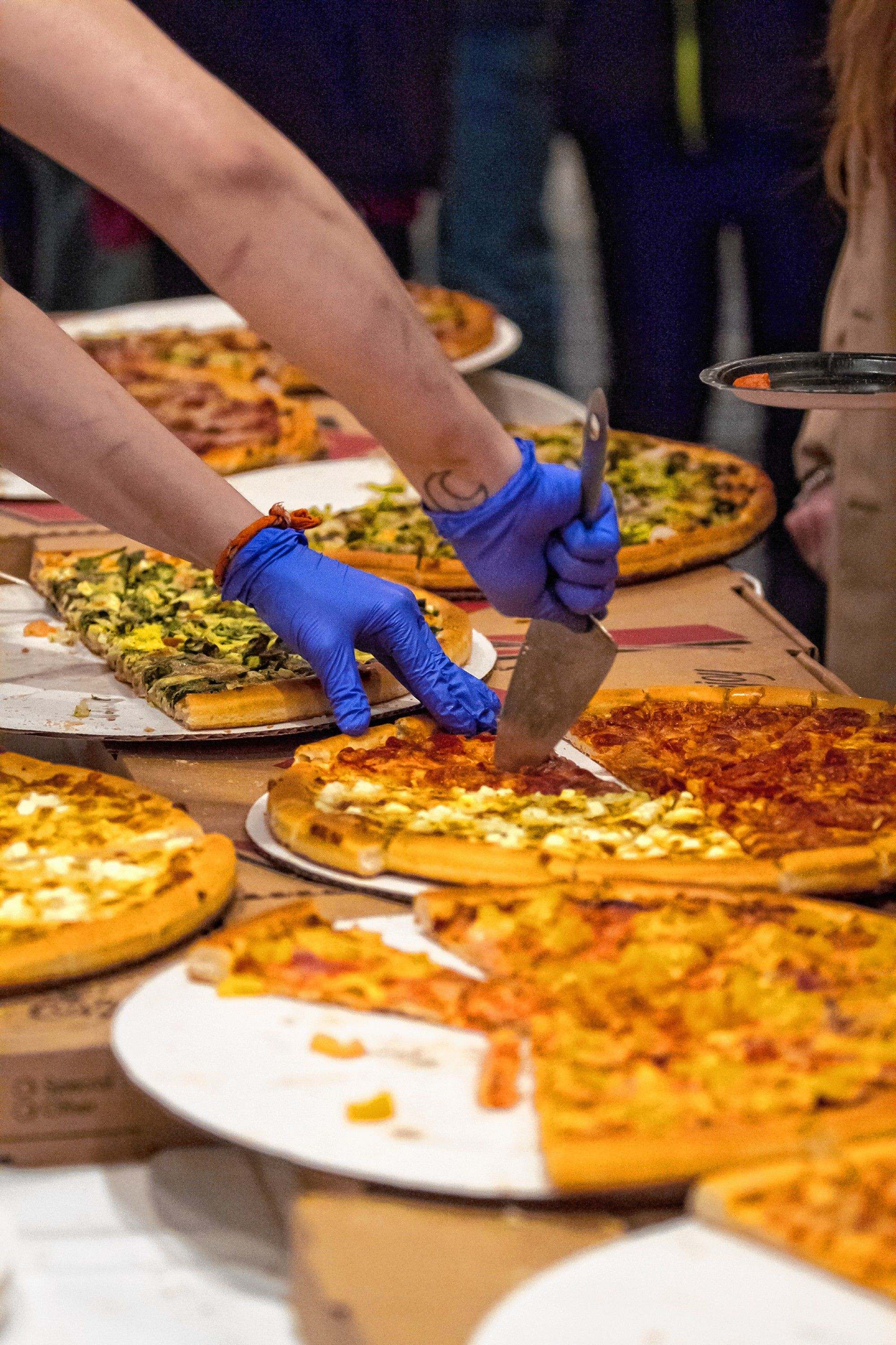 Chiefs Place serves slices during the Pizza Pie Showdown at the Holiday Inn in downtown Concord on Pi Day, Mar. 14, 2018. Proceeds from the event, hosted by the Concord Monitor and Insider, went to support the Friendly Kitchen. (ELIZABETH FRANTZ / Monitor staff) Elizabeth Frantz