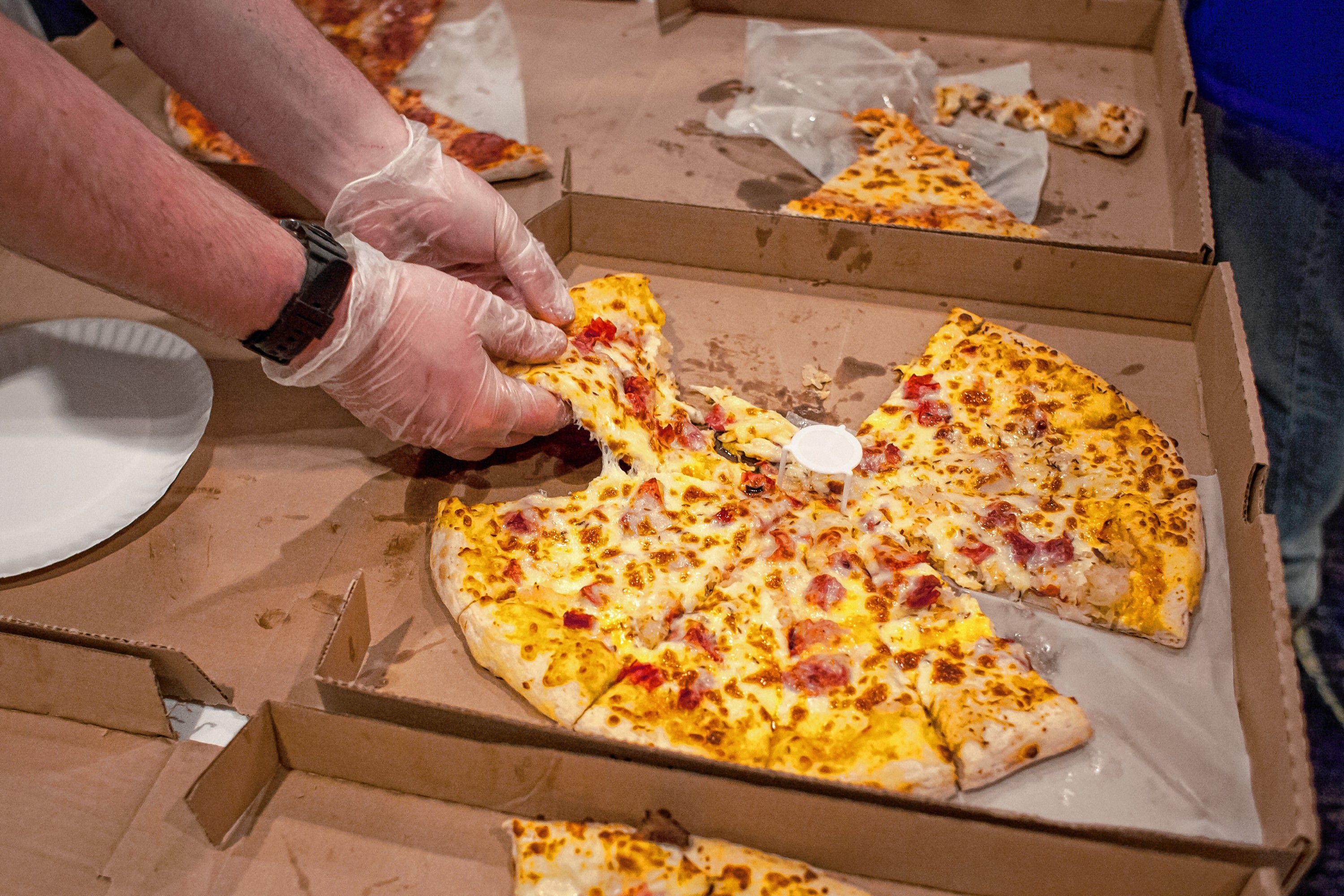 Checkmate Pizza serves slices of Reuben pizza during the Pizza Pie Showdown at the Holiday Inn in downtown Concord on Pi Day, Mar. 14, 2018. Proceeds from the event, hosted by the Concord Monitor and Insider, went to support the Friendly Kitchen. (ELIZABETH FRANTZ / Monitor staff) Elizabeth Frantz