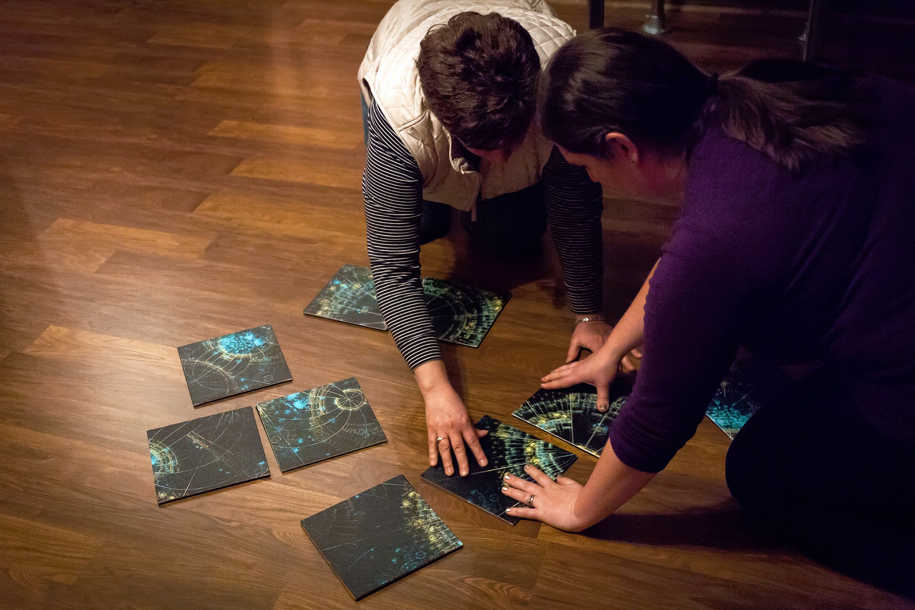 Sarah Pearson (right) and her mother Lucie Kinney arrange pieces of a puzzle during a Concord Insider/Monitor team tackle of The Enigma at the Escape Room in Concord on Wednesday, April 25, 2018. (ELIZABETH FRANTZ / Monitor staff) Elizabeth Frantz