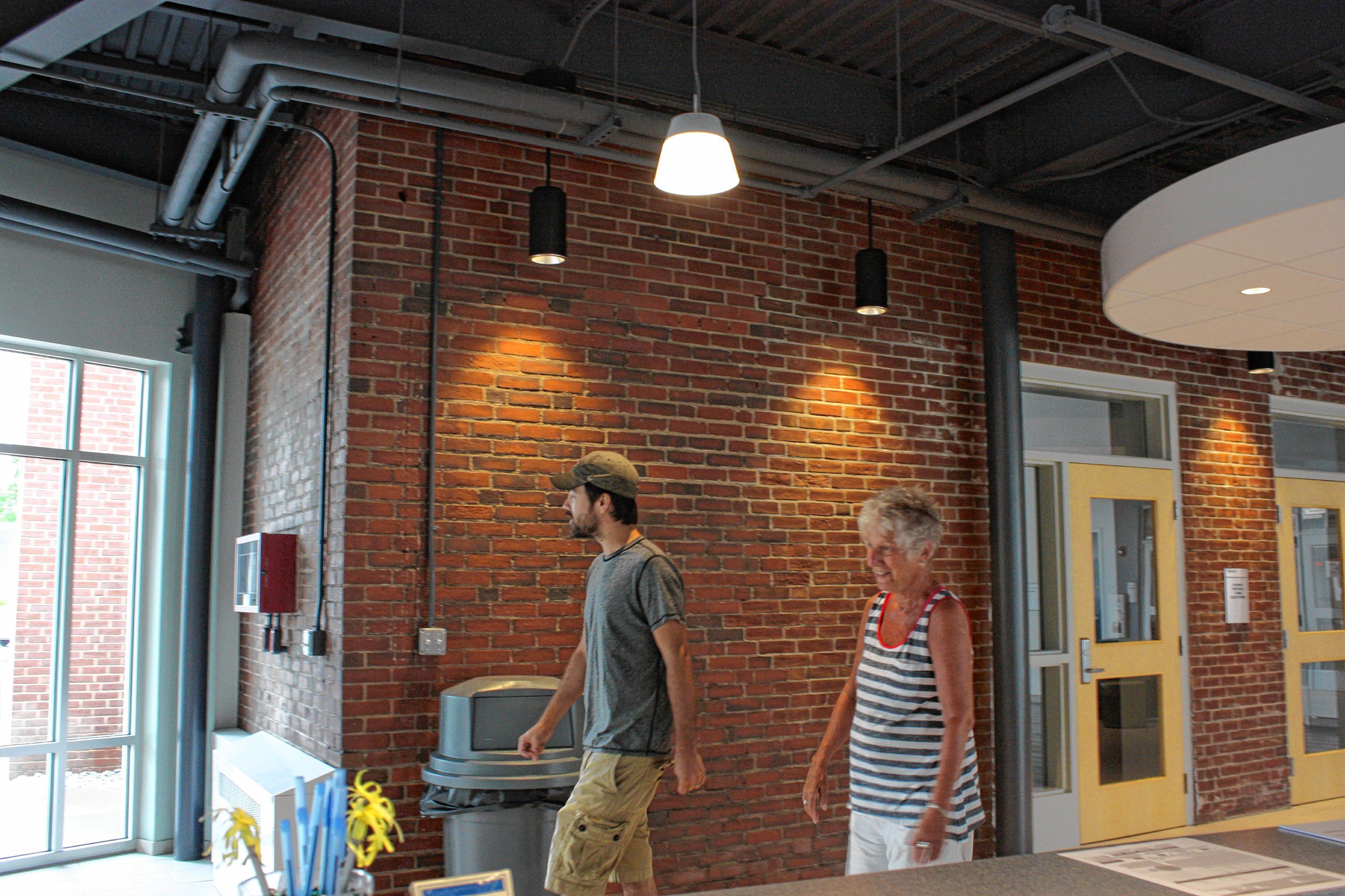 Jon gets a feel for some of the senior programming offered at the new City Wide Community Center by taking a leisurely stroll around the building with Jan Wilcox last week. The center hosts senior walking every Monday, Wednesday and Friday. RIELLY MANN / For the Insider