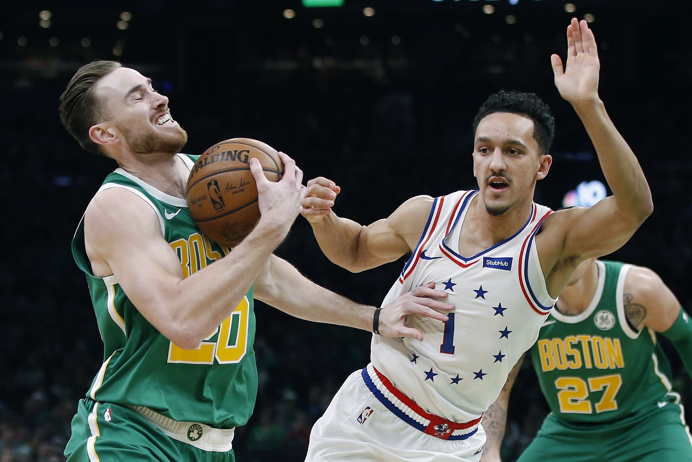 Boston Celtics' Gordon Hayward (20) is defended by Philadelphia 76ers' Landry Shamet (1) during the first half of an NBA basketball game in Boston, Tuesday, Dec. 25, 2018. (AP Photo/Michael Dwyer)  Michael Dwyer