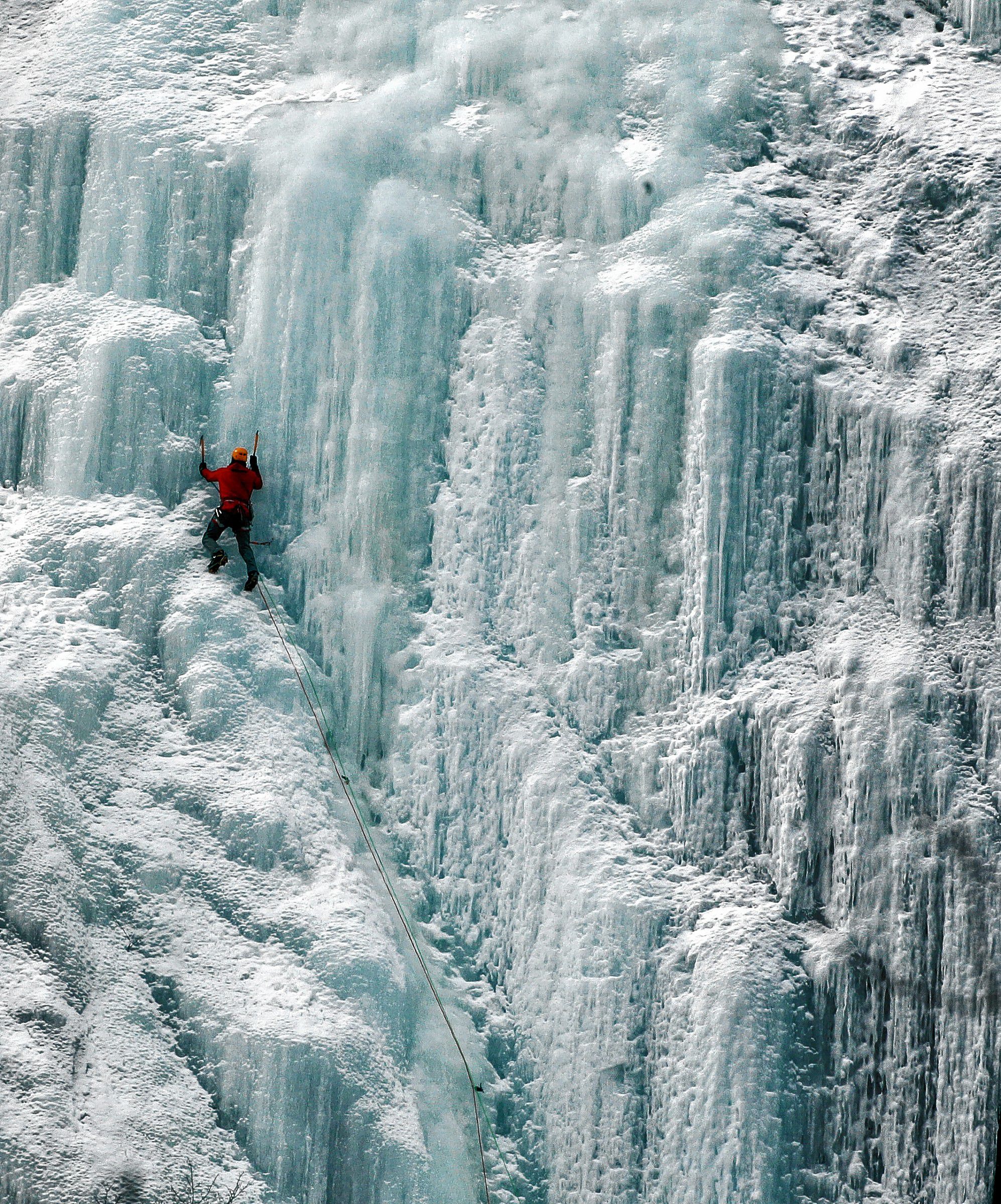 An ice climber makes his way up Frankenstein Cliff in Hart's Location, N.H. on Saturday, March 1, 2014. A deep freeze is crossing through New England keeping the ice in good condition for the sport. (AP Photo/Jim Cole) Jim Cole