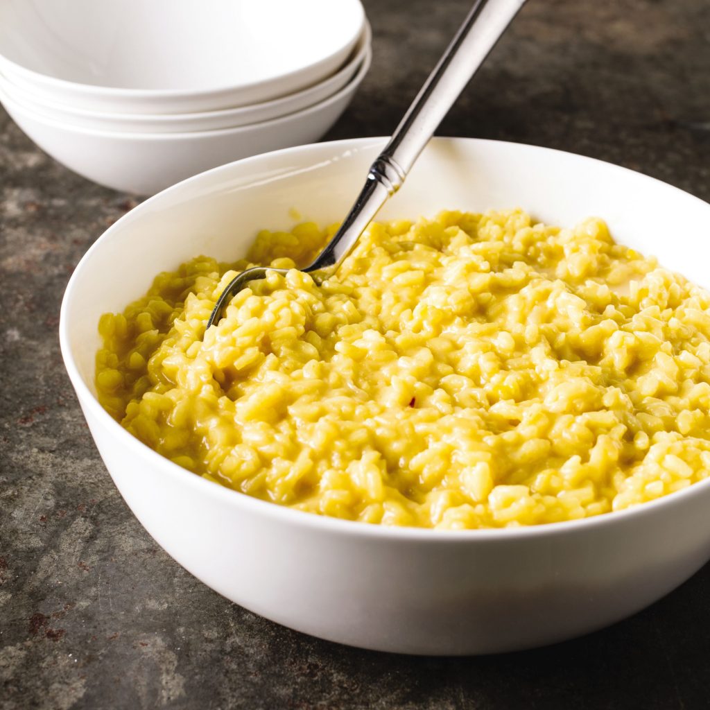 This undated photo provided by America's Test Kitchen in October 2018 shows Saffron Risotto in Brookline, Mass. This recipe appears in the cookbook "Tasting Italy." (Steve Klise/America's Test Kitchen via AP)  Steve Klise