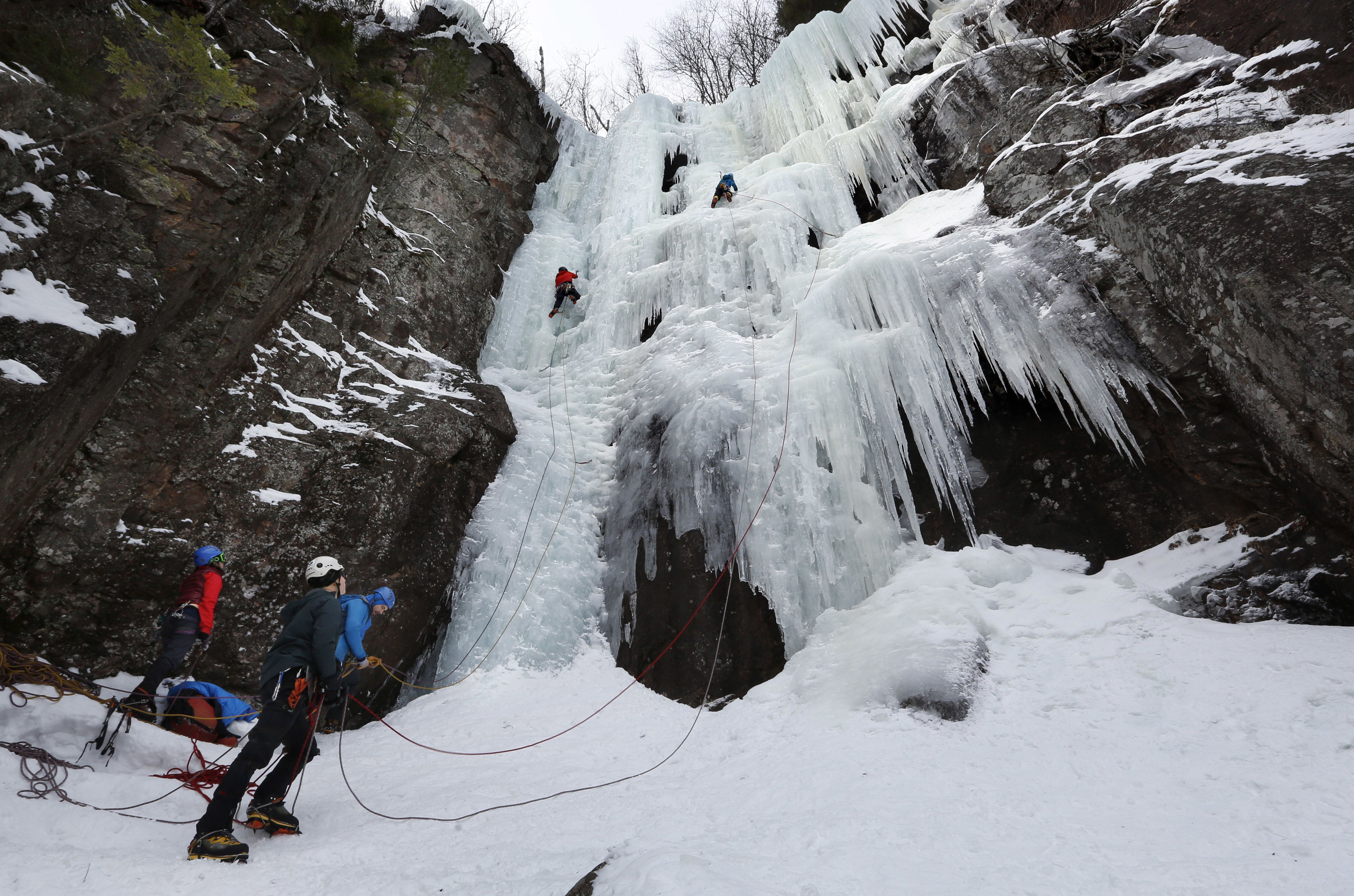 In this Sunday, Feb. 6, 2017 photo, two climbers ascend "Dracula," an ice climbing route on Frankenstein Cliff in Hart's Location, N.H. (AP Photo/Robert F. Bukaty) Robert F. Bukaty