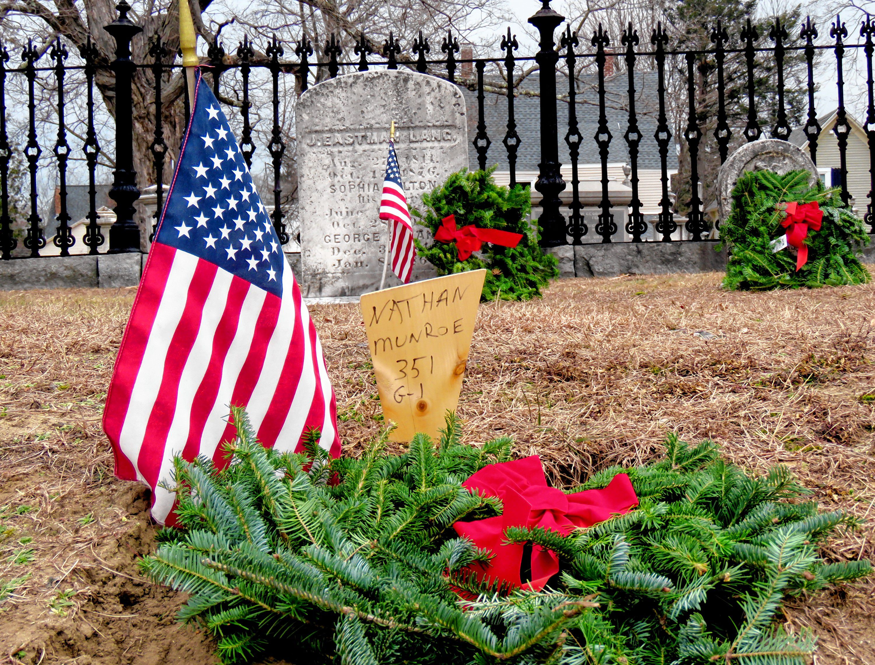 Wreaths meant to honor veterans at the Old North Cemetery in Concord are shown on the morning of Friday, Dec. 14, 2018. Caitlin Andrews