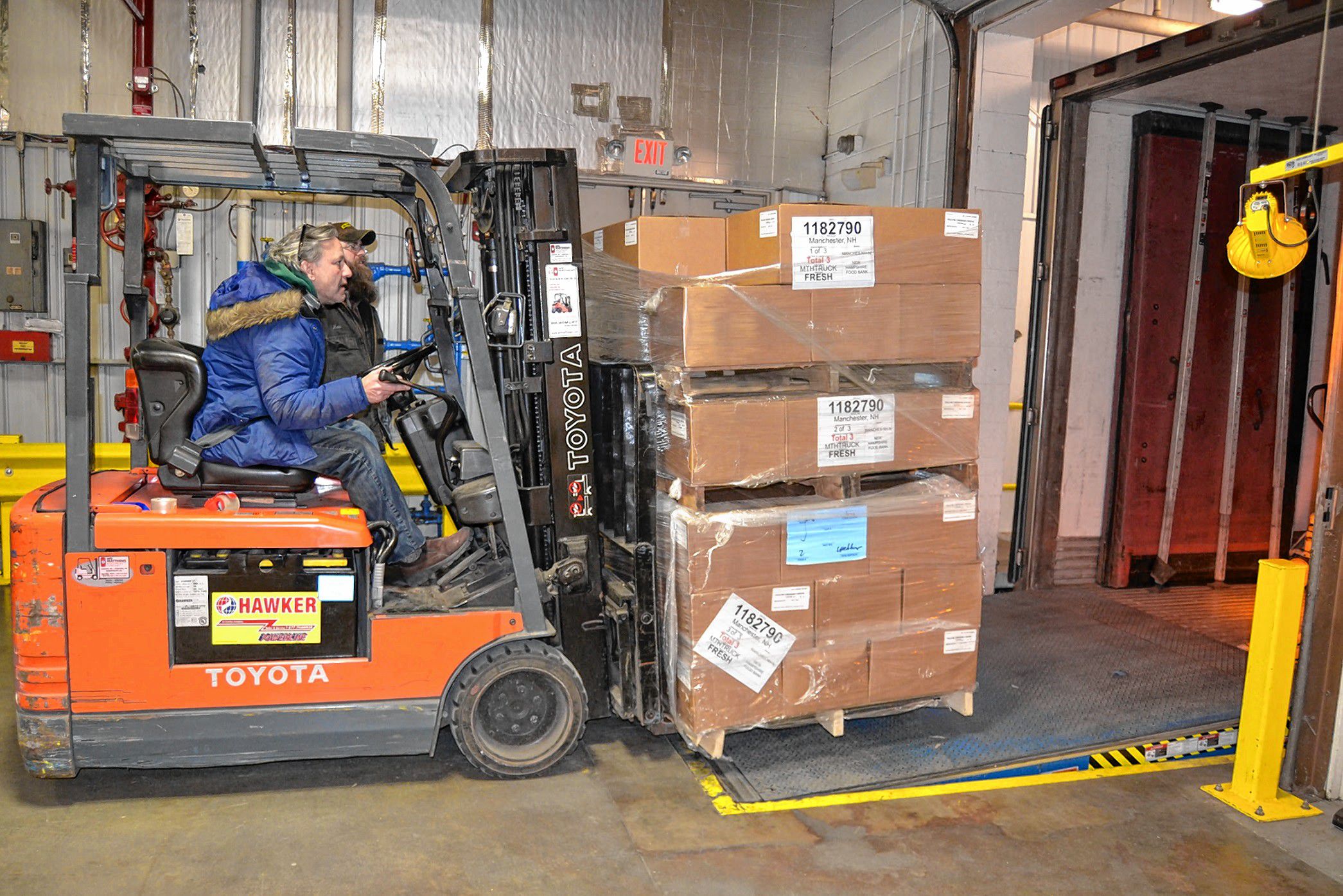 Catholic Charities USA recently donated 2,760 pounds of cheddar cheese to the New Hampshire Food Bank. The New Hampshire Food Bank has already distributed the cheese throughout its network of more than 425 partner agencies across the state. Pictured here, the New Hampshire Food Bank unloads the donation of cheese.