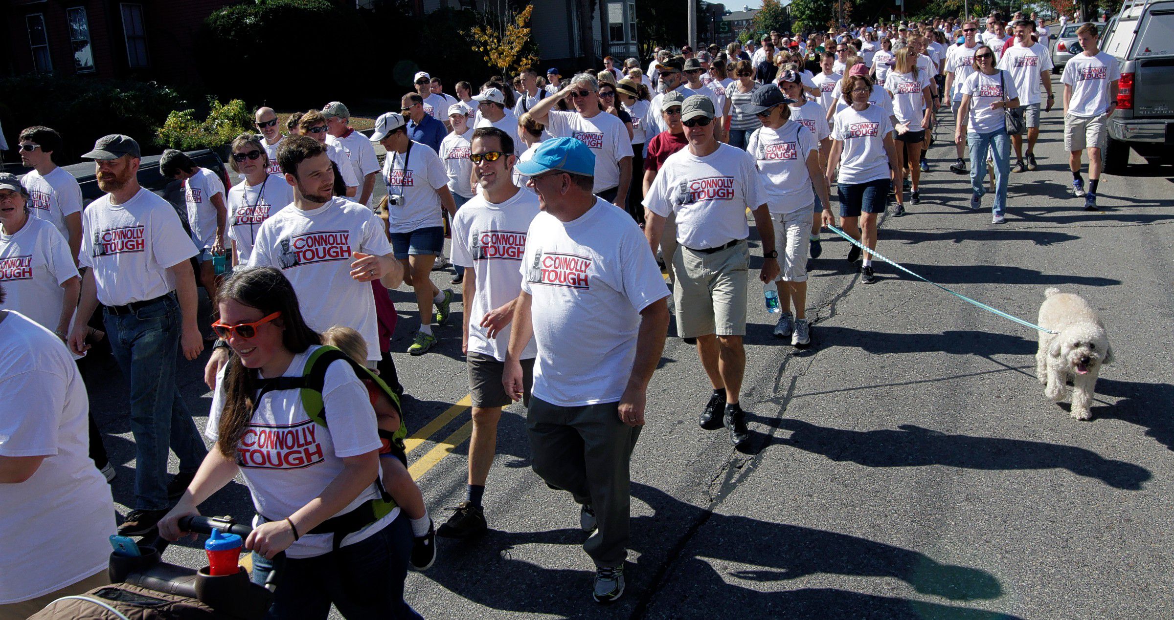 Participants in the ALS walk parade down Pleasant Street Saturday morning in support of Concord High School Principal Gene Connolly.  (GEOFF FORESTER / Monitor staff) Participants in the ALS walk head down Pleasant Street yesterday morning in support of Concord High School Principal Gene Connolly.(GEOFF FORESTER / Monitor staff) GEOFF FORESTER