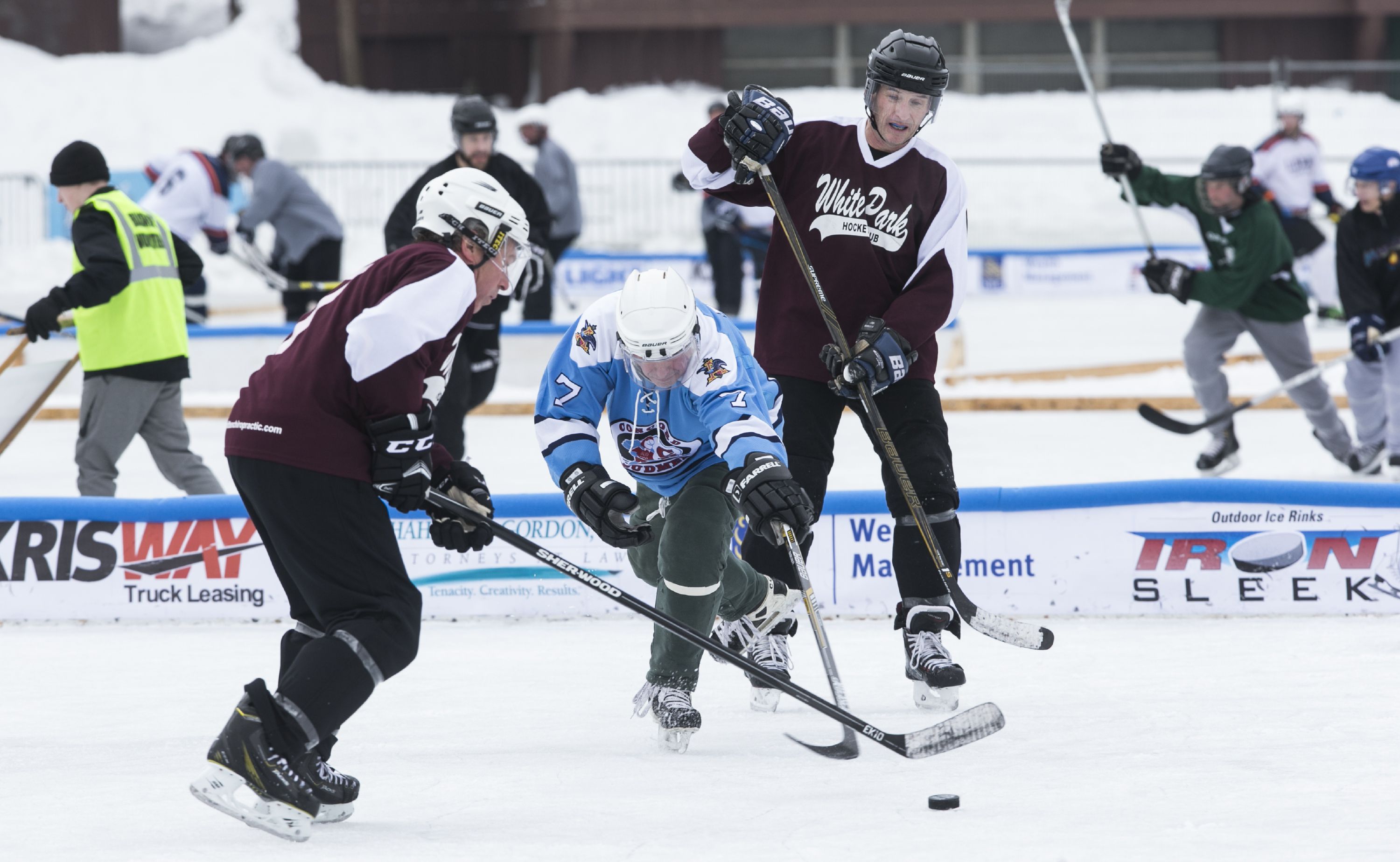 The Budmen and White Park Hockey Club battle it out on Saturday at the Black Ice Pond Hockey Tournament at White Park. The Budmen won 5-2. GEOFF FORESTER